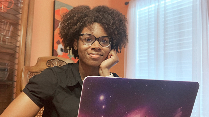 Intern Alyssa Rorie analyzes lab results from a biologics manufacturing site in Massachusetts at her dining room table in Raleigh, North Carolina.