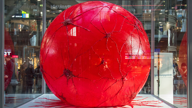 Bristol Myers Squibb Germany launched a unique cancer awareness installation in Berlin's central station, featuring an oversized, life-like model of a cancer cell.