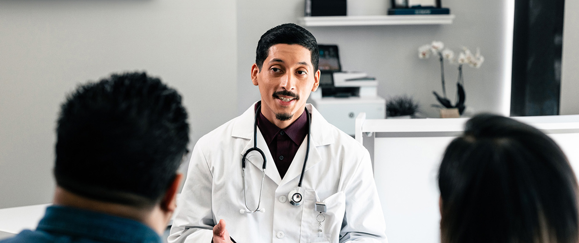 Doctor in office discussing options with patient