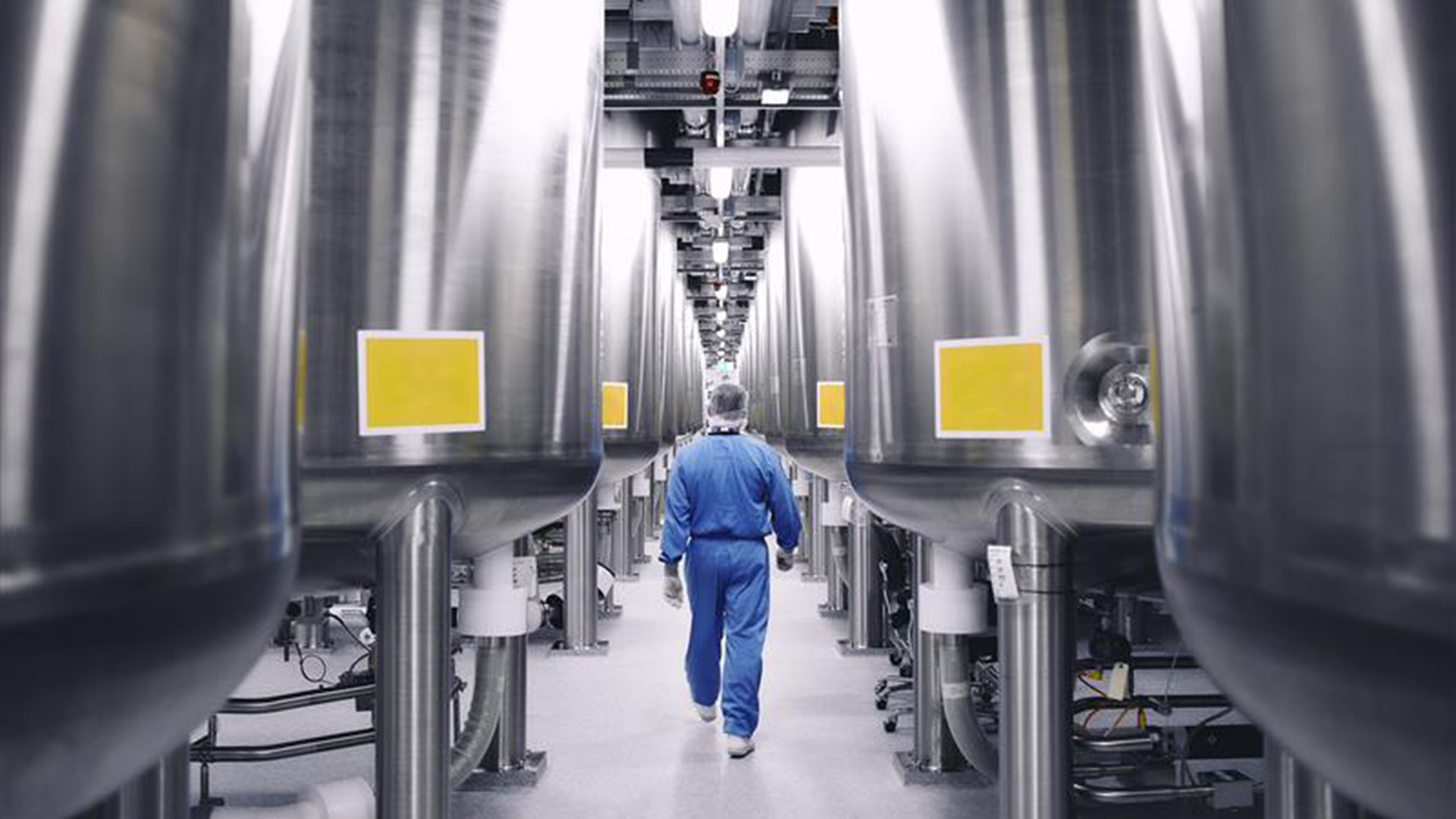 employee walking in manufacturing room