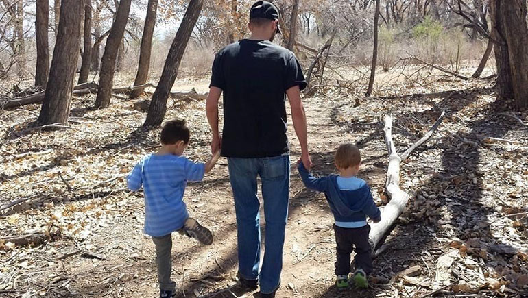Matt and his sons take a walk through the woods.
