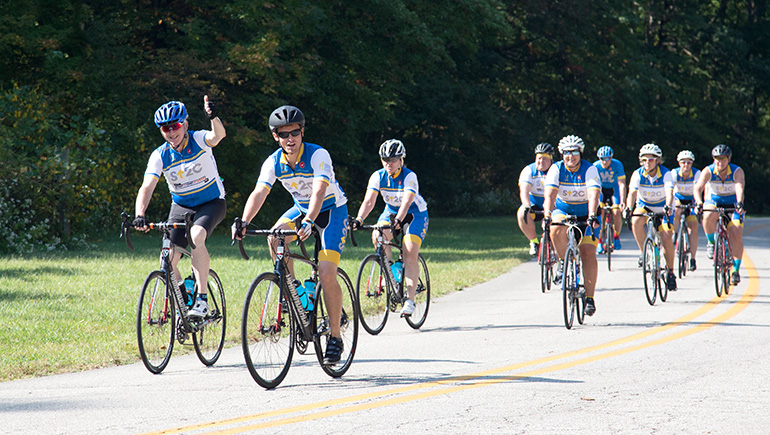 Chief Scientific Officer, Tom Lynch, leads group of cyclists during ride