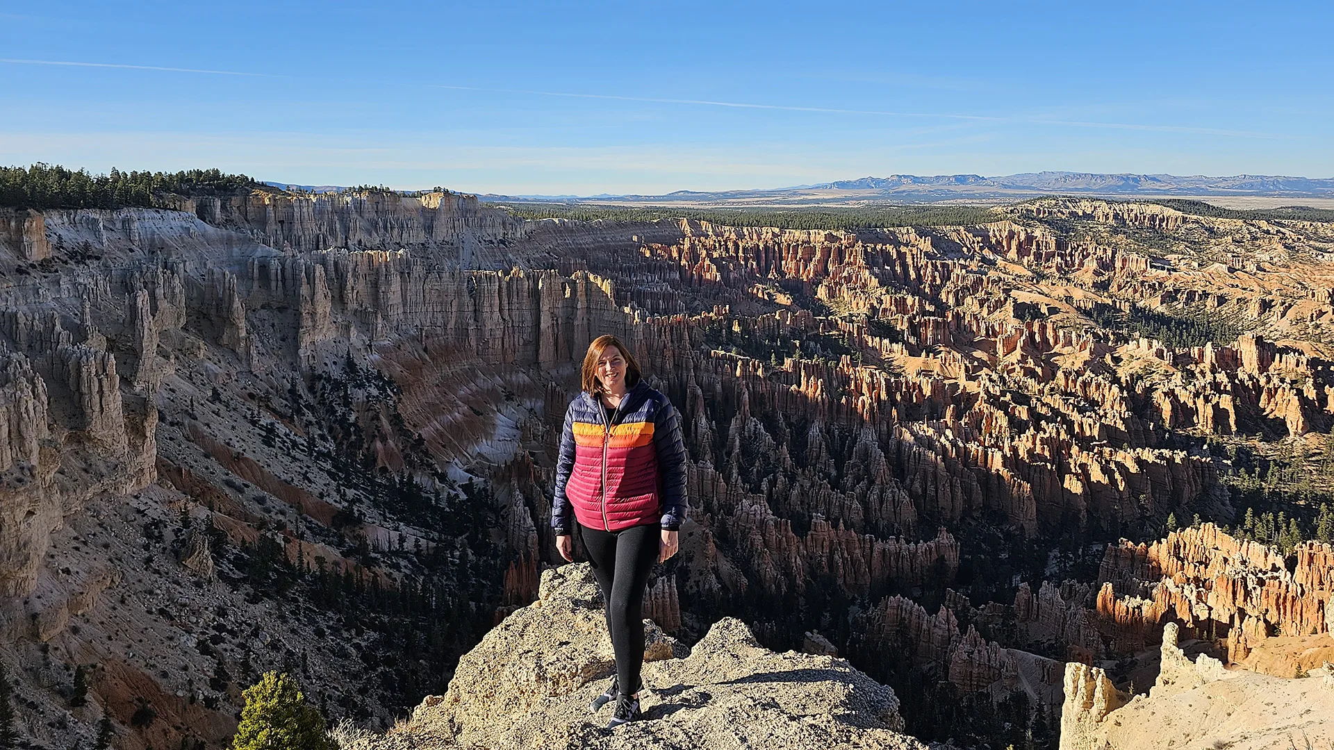 Our colleague’ standing on a canyon ridge with a panoramic view