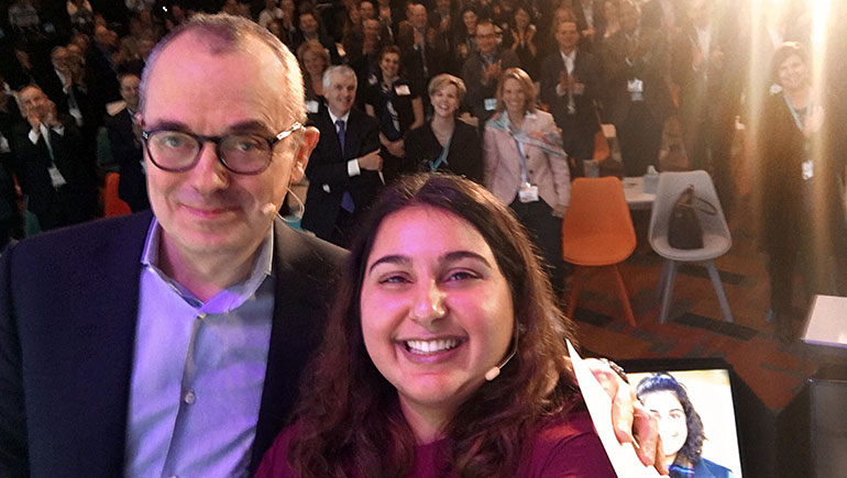 Caforio taking a selfie with Mitra, a patient whose mom is a scientist at Bristol-Myers Squibb.